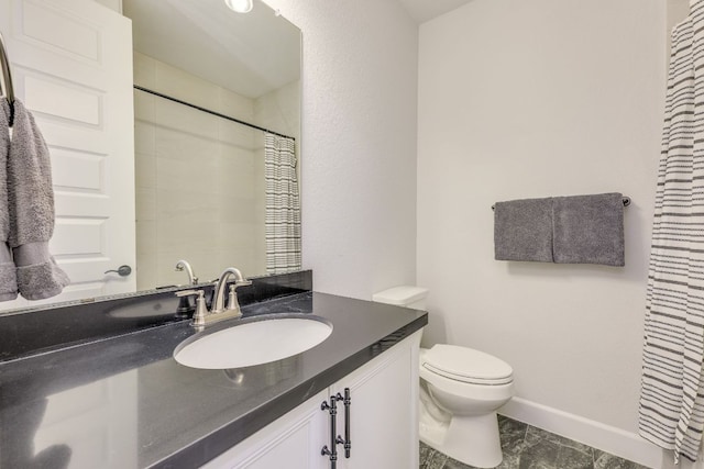 603 Arundel Rd, Austin, TX 78738 - full bath with a shower, vanity, toilet, and baseboards