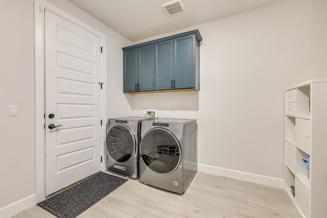 603 Arundel Rd, Austin, TX 78738 - laundry area featuring washer and dryer, light wood-type flooring, and baseboards