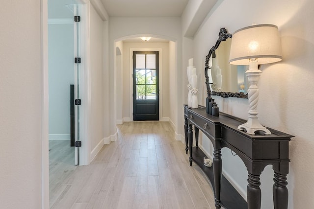 603 Arundel Rd, Austin, TX 78738 - entrance foyer featuring arched walkways and light wood-style floors