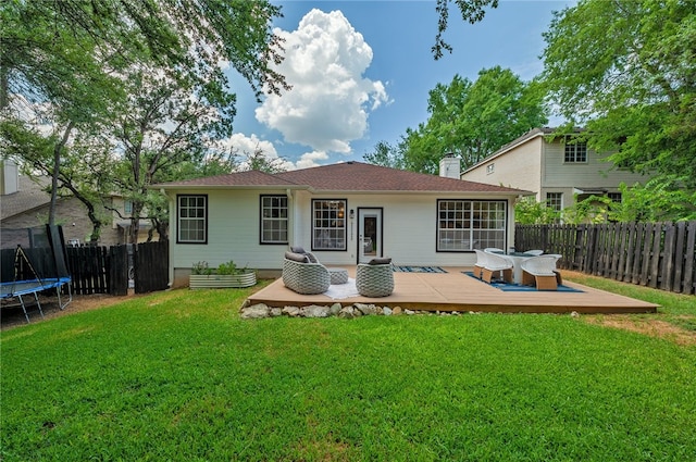 208 Sailors Run, Lakeway, TX 78734 - rear view of house featuring a trampoline, a deck, and a chimney