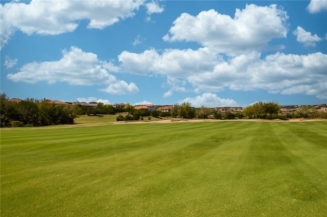 208 Sailors Run, Lakeway, TX 78734 - surrounding community with view of golf course and a lawn