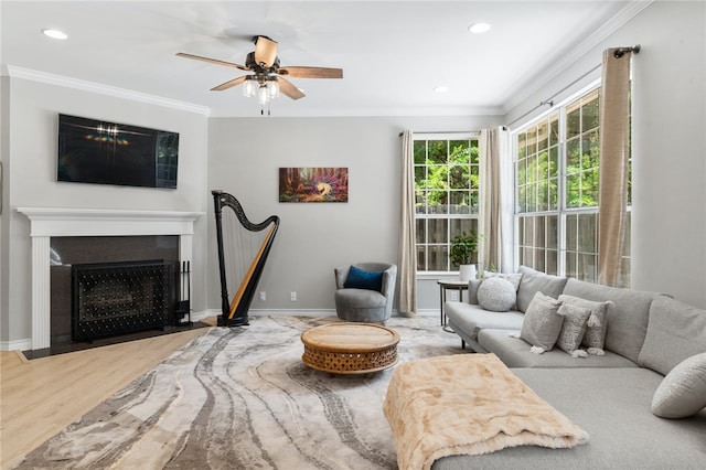 208 Sailors Run, Lakeway, TX 78734 - living room with ornamental molding, a ceiling fan, wood finished floors, baseboards, and recessed lighting