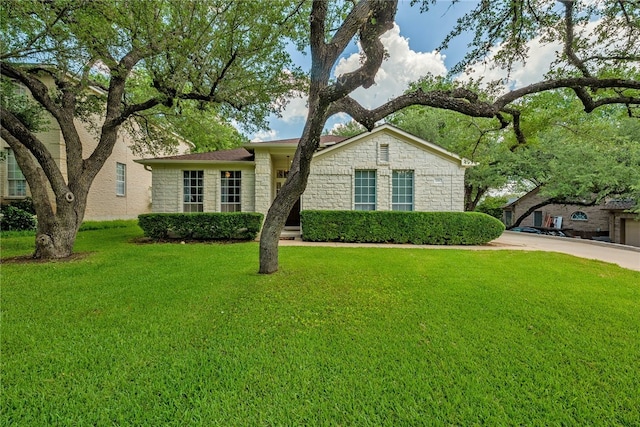 208 Sailors Run, Lakeway, TX 78734 - view of front of property with stone siding and a front yard