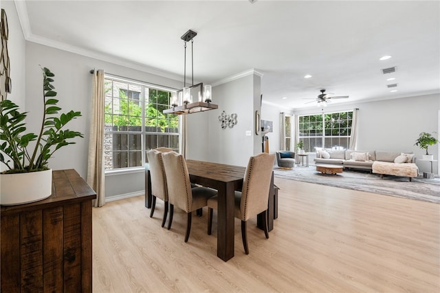 208 Sailors Run, Lakeway, TX 78734 - dining space featuring light wood-style floors, healthy amount of natural light, ornamental molding, recessed lighting, and a ceiling fan