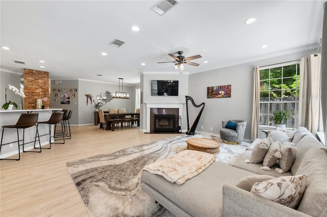 208 Sailors Run, Lakeway, TX 78734 - living area featuring crown molding, light wood-type flooring, recessed lighting, baseboards, and ceiling fan