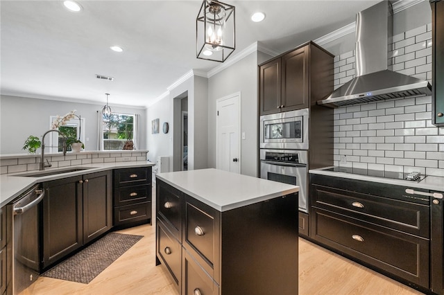 208 Sailors Run, Lakeway, TX 78734 - kitchen featuring appliances with stainless steel finishes, wall chimney range hood, a sink, ornamental molding, and tasteful backsplash