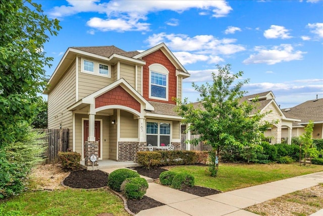 163 Wainscot Oak Way, San Marcos, TX 78666 - craftsman-style home featuring a porch, brick siding, and a shingled roof