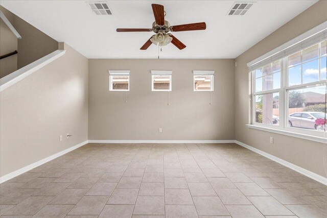 163 Wainscot Oak Way, San Marcos, TX 78666 - unfurnished room with a ceiling fan, light tile patterned flooring, and baseboards