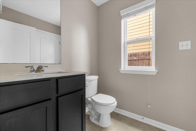 163 Wainscot Oak Way, San Marcos, TX 78666 - half bath featuring toilet, vanity, baseboards, and tile patterned flooring