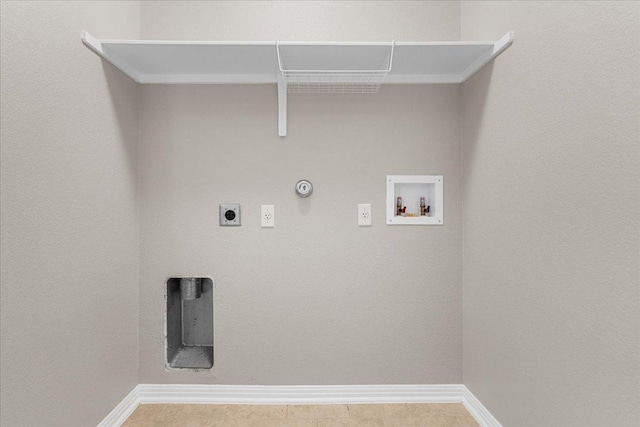 163 Wainscot Oak Way, San Marcos, TX 78666 - laundry area featuring hookup for a gas dryer, hookup for a washing machine, electric dryer hookup, and baseboards