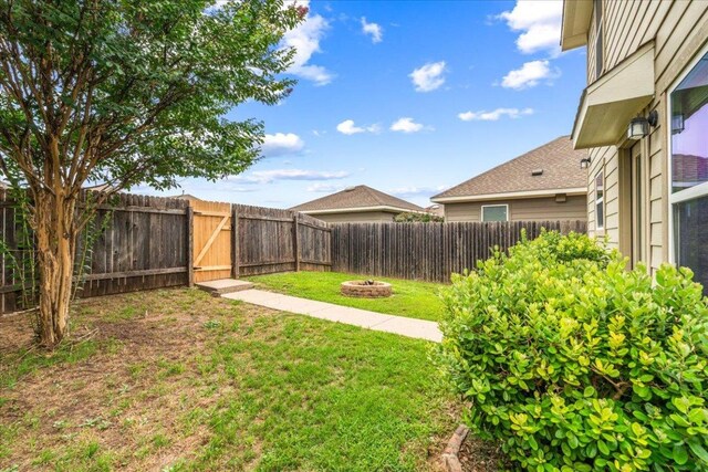 163 Wainscot Oak Way, San Marcos, TX 78666 - view of yard featuring an outdoor fire pit