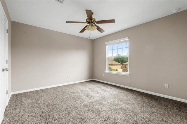163 Wainscot Oak Way, San Marcos, TX 78666 - carpeted spare room featuring a ceiling fan, baseboards, and a smoke detector