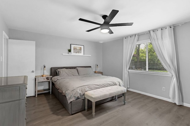 609 Blackberry Dr, Austin, TX 78745 - bedroom featuring wood finished floors, baseboards, and a ceiling fan