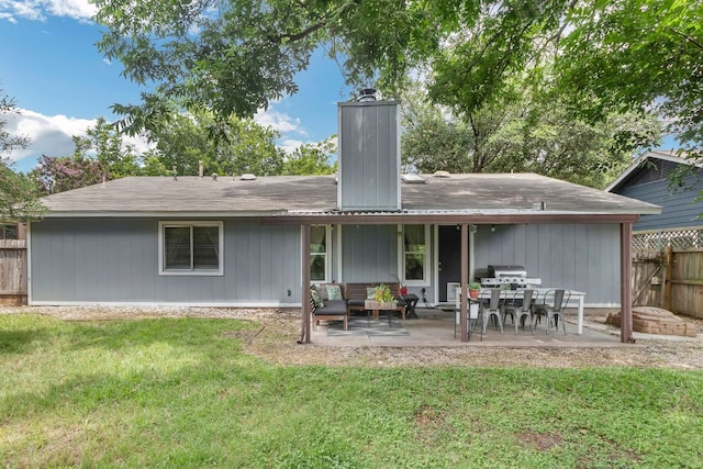 609 Blackberry Dr, Austin, TX 78745 - back of house featuring a chimney and a patio area