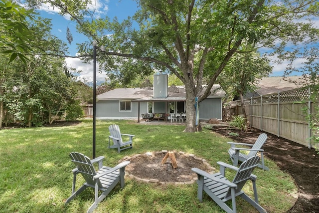 609 Blackberry Dr, Austin, TX 78745 - rear view of house featuring an outdoor fire pit, a chimney, and a patio