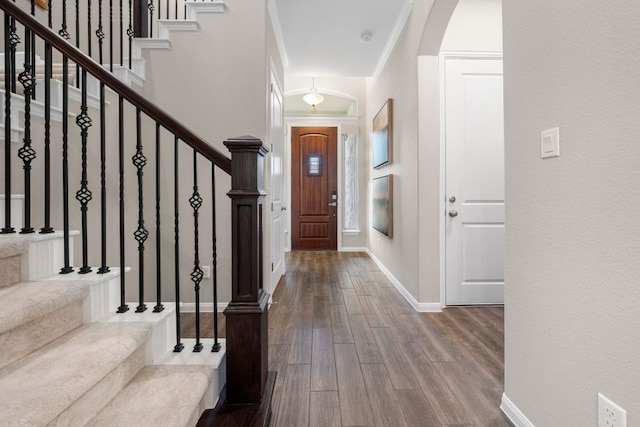 121 Cartwheel Bnd Unit 42, Austin, TX 78738 - foyer entrance with wood finished floors, arched walkways, stairs, and baseboards