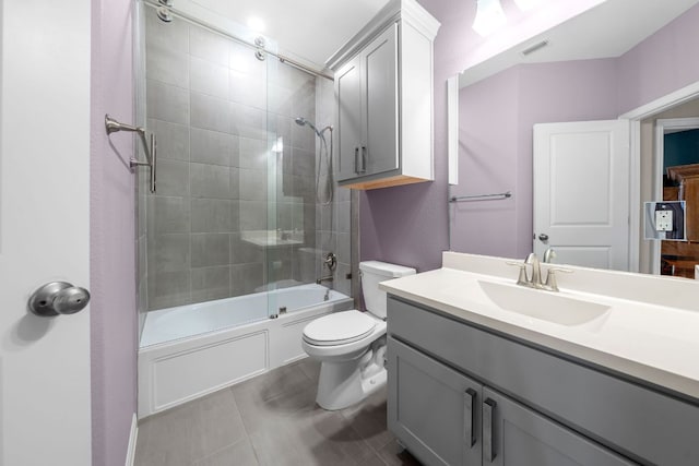 121 Cartwheel Bnd Unit 42, Austin, TX 78738 - full bathroom featuring toilet, enclosed tub / shower combo, vanity, and tile patterned floors