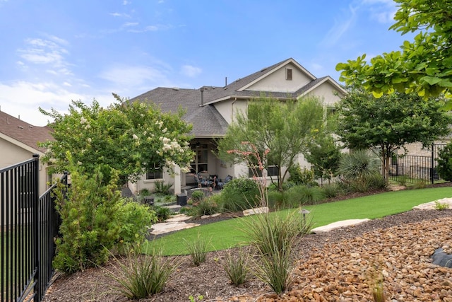 121 Cartwheel Bnd Unit 42, Austin, TX 78738 - obstructed view of property with stucco siding and roof with shingles