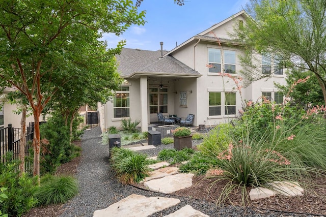 121 Cartwheel Bnd Unit 42, Austin, TX 78738 - rear view of property featuring ceiling fan, stucco siding, and a patio