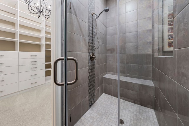 121 Cartwheel Bnd Unit 42, Austin, TX 78738 - bathroom featuring a shower stall and a chandelier