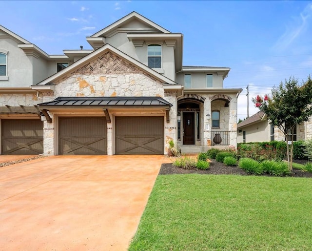 121 Cartwheel Bnd Unit 42, Austin, TX 78738 - view of front of home featuring stone siding, a front lawn, a porch, driveway, and a standing seam roof