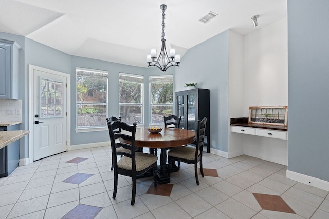 820 Morgan Hill Dr, Dripping Springs, TX 78620 - dining area featuring a chandelier, light tile patterned floors, and baseboards