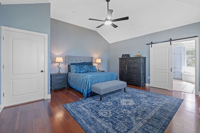 820 Morgan Hill Dr, Dripping Springs, TX 78620 - bedroom with a barn door, lofted ceiling, wood finished floors, a ceiling fan, and ensuite bath