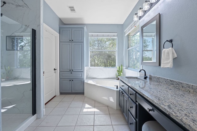 820 Morgan Hill Dr, Dripping Springs, TX 78620 - full bathroom with a garden tub, vanity, and a marble finish shower