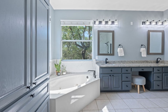 820 Morgan Hill Dr, Dripping Springs, TX 78620 - full bath featuring double vanity, a jetted tub, and tile patterned floors