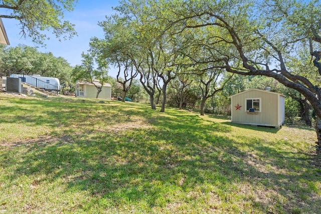 820 Morgan Hill Dr, Dripping Springs, TX 78620 - view of green lawn with cooling unit