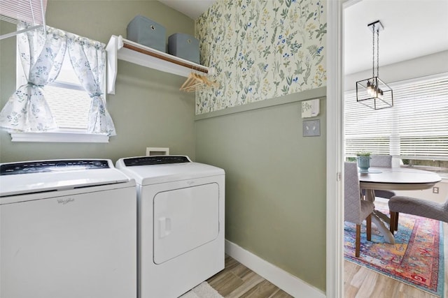 2021 Kimbrook Dr, Round Rock, TX 78681 - laundry area featuring washer and clothes dryer, light wood-style floors, and baseboards