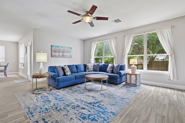2021 Kimbrook Dr, Round Rock, TX 78681 - living room featuring a ceiling fan, wood finished floors, and baseboards