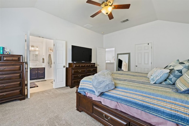 2021 Kimbrook Dr, Round Rock, TX 78681 - bedroom with vaulted ceiling, light colored carpet, connected bathroom, and ceiling fan