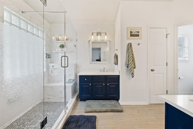 2021 Kimbrook Dr, Round Rock, TX 78681 - full bath featuring vanity, a marble finish shower, and wood finished floors