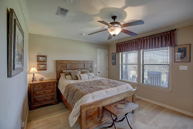3514 Fm 3509, Burnet, TX 78611 - bedroom with light wood-style floors, baseboards, ornamental molding, and ceiling fan