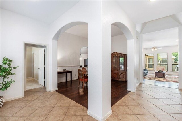 2709 Sun Mountain Dr, Leander, TX 78641 - entrance foyer with arched walkways, ceiling fan, and light tile patterned floors