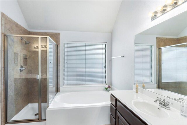 2709 Sun Mountain Dr, Leander, TX 78641 - full bath with vaulted ceiling, vanity, a bath, and a shower stall