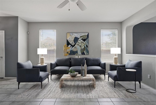 144 Holstein St, Hutto, TX 78634 - living area with tile patterned floors, healthy amount of natural light, and a ceiling fan