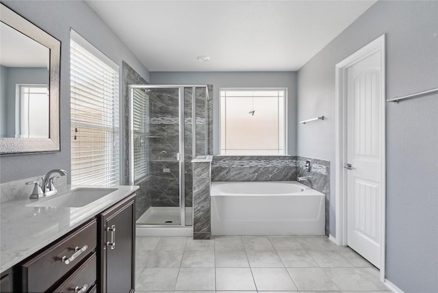 144 Holstein St, Hutto, TX 78634 - full bathroom with vanity, a bath, a shower stall, and tile patterned floors