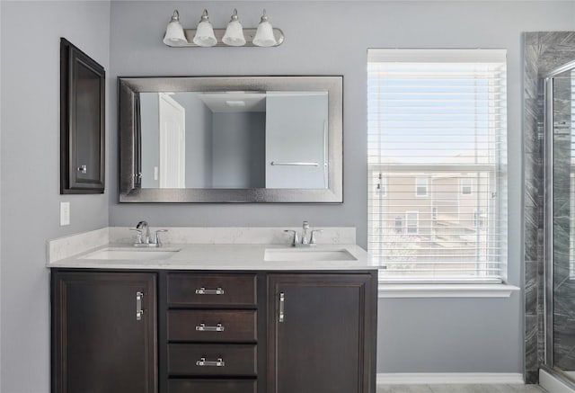 144 Holstein St, Hutto, TX 78634 - full bath with a stall shower, double vanity, and plenty of natural light