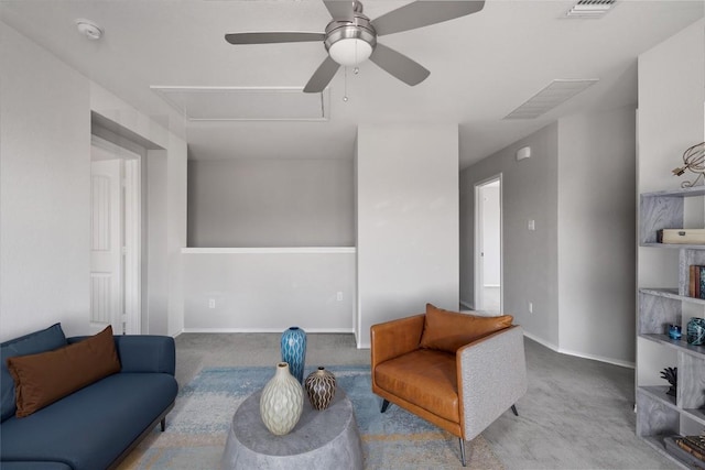 144 Holstein St, Hutto, TX 78634 - sitting room featuring carpet flooring, a ceiling fan, and attic access