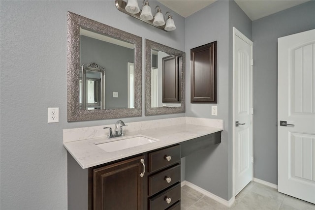 144 Holstein St, Hutto, TX 78634 - bathroom with vanity and tile patterned floors