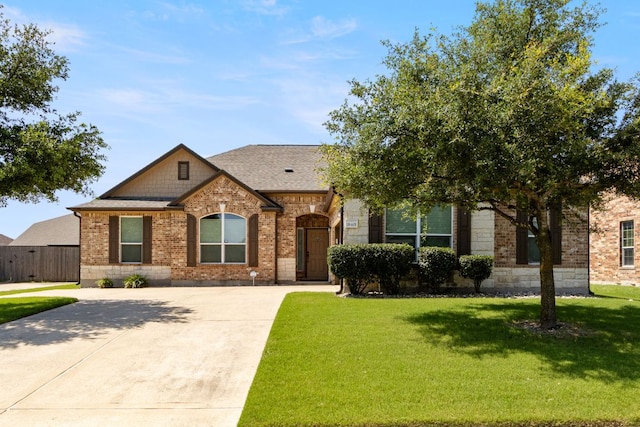 18401 Pencil Cactus Dr, Pflugerville, TX 78660 - view of front of property featuring brick siding, driveway, and roof with shingles