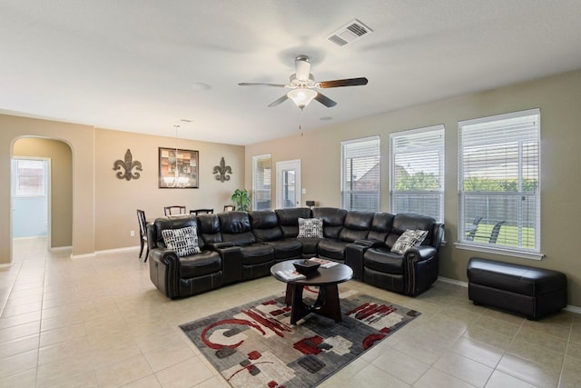 18401 Pencil Cactus Dr, Pflugerville, TX 78660 - living area featuring light tile patterned flooring, arched walkways, and a ceiling fan