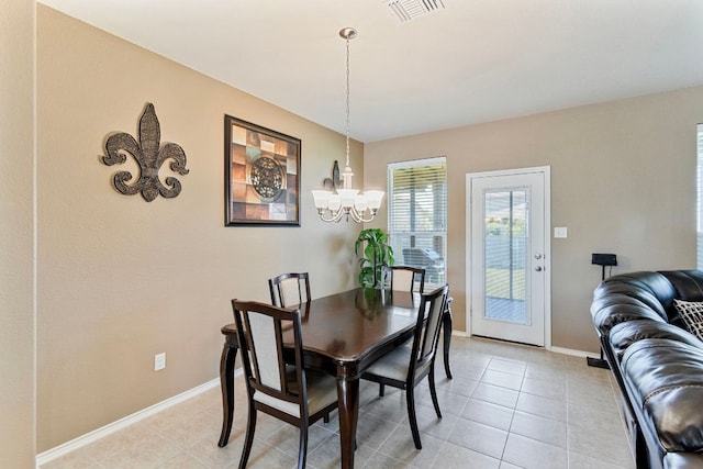 18401 Pencil Cactus Dr, Pflugerville, TX 78660 - dining room with a chandelier and light tile patterned flooring