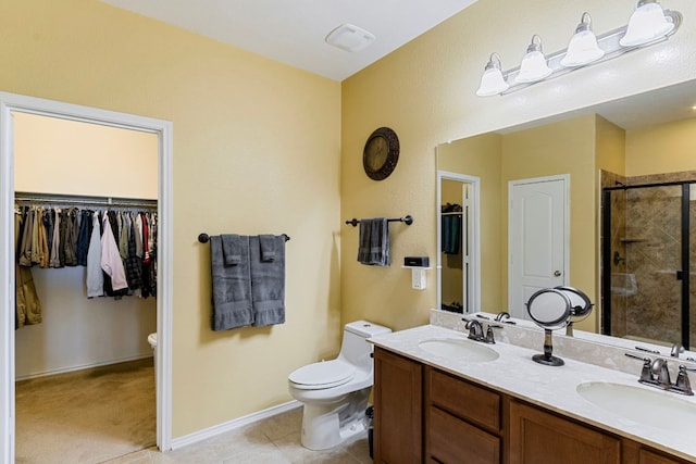 18401 Pencil Cactus Dr, Pflugerville, TX 78660 - full bathroom with a shower stall, double vanity, a walk in closet, and tile patterned flooring