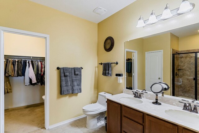18401 Pencil Cactus Dr, Pflugerville, TX 78660 - full bathroom with a shower stall, double vanity, a spacious closet, and tile patterned flooring