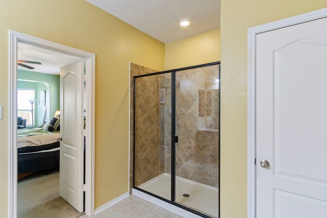 18401 Pencil Cactus Dr, Pflugerville, TX 78660 - bathroom featuring ensuite bath, a stall shower, ceiling fan, and tile patterned flooring