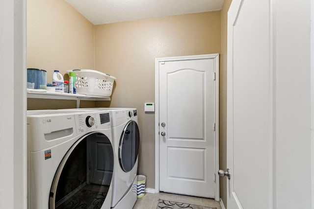18401 Pencil Cactus Dr, Pflugerville, TX 78660 - laundry room featuring independent washer and dryer and light tile patterned floors