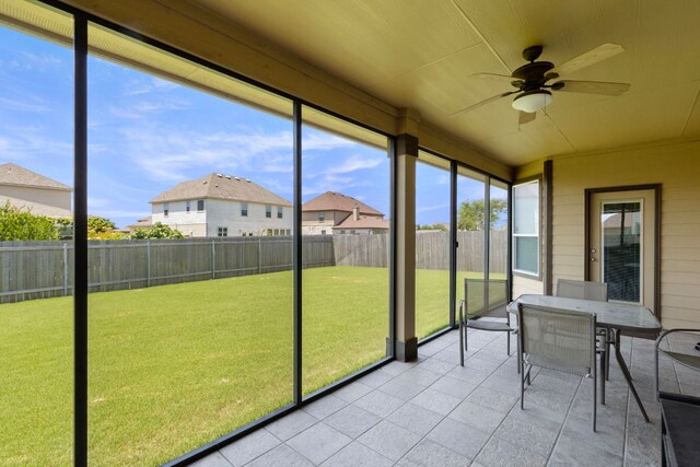 18401 Pencil Cactus Dr, Pflugerville, TX 78660 - sunroom / solarium with a ceiling fan, outdoor dining space, and a residential view